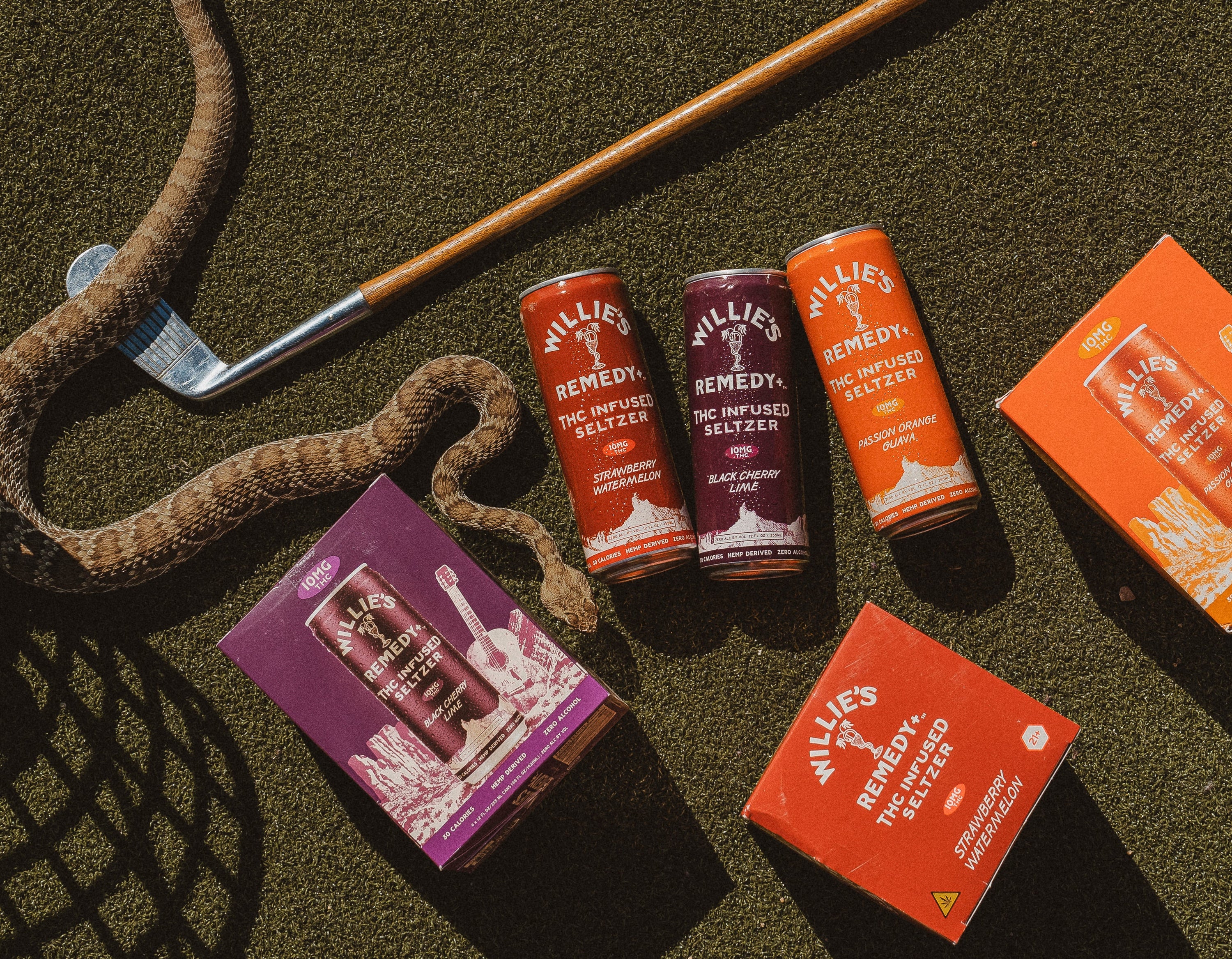 drink willies thc drink cans on green background with snake